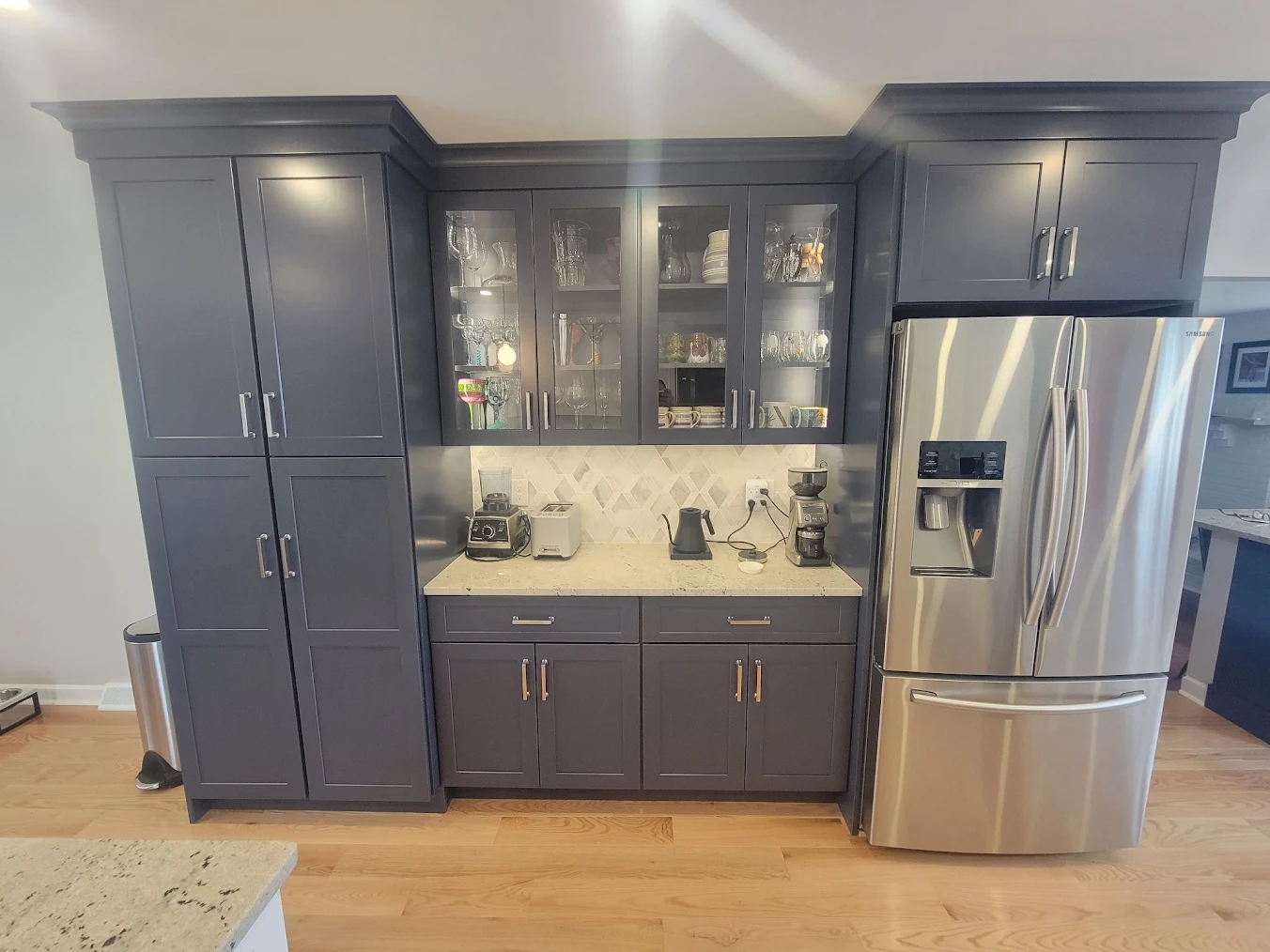Kitchen cabinets, storage, and fridge.